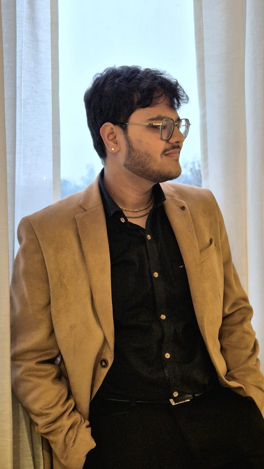 Krishna Mittal, digital marketer and AI automation builder, photographed against a plain backdrop